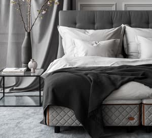 Bedroom environment - DUX bed 2002 with Dante headboard and Alberto table. 